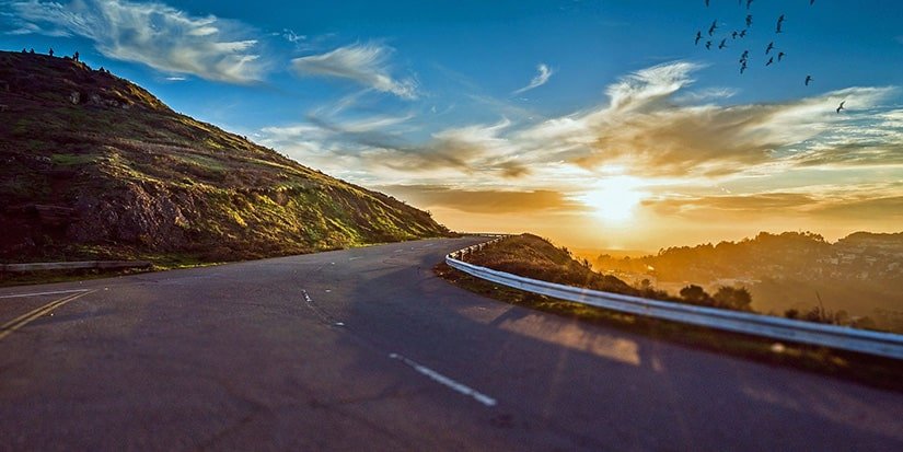 winding-road-1556177_1920-1920×960-min Beautiful sunset over a winding mountain highway
